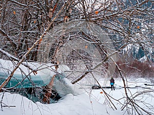 Winter mountain landscape with a photographer