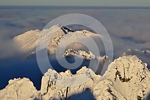 Winter mountain landscape with sea of clouds.