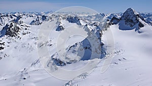 Winter mountain landscape in the Silvretta mountain range in the Swiss Alps with famous Piz Buin mountain peak in the center