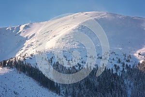 Winter mountain landscape, snowy peak in Low Tatras, Slovakia
