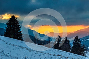 Winter mountain landscape at sunset