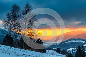 Winter mountain landscape at sunset
