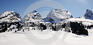 Winter mountain landscape with three impressive peaks