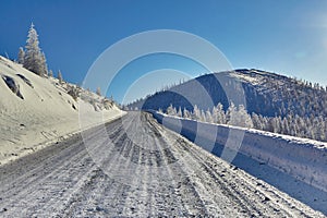 Winter. Mountain road, climb to the pass. The mountains. Snow