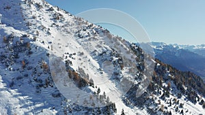 Winter mountain slopes filmed sidewards