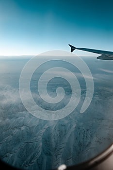 A winter mountain view from plane window