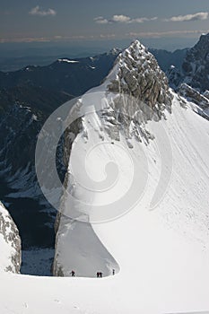 Winter mountaineers in Julian Alps photo