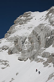 Winter mountaineers in Julian Alps photo