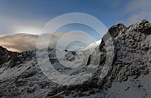 Winter Mountains. Clouds Blown by the Wind Over the Summit.