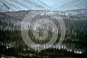 Winter mountains in frost smoke of upland