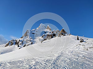 Winter in the mountains. Hiking during wintertime. Snow storm in the high mountains