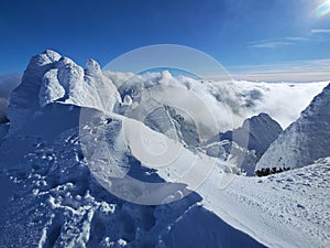 Winter in the mountains. Hiking during wintertime. Snow storm in the high mountains