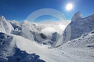 Winter in the mountains. Hiking during wintertime. Snow storm in the high mountains