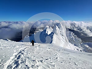 Winter in the mountains. Hiking during wintertime. Snow storm in the high mountains