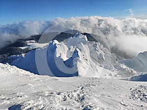 Winter in the mountains. Hiking during wintertime. Snow storm in the high mountains