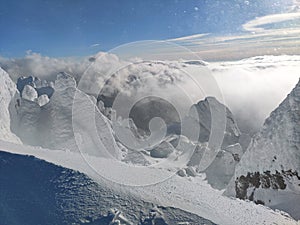 Winter in the mountains. Hiking during wintertime. Snow storm in the high mountains