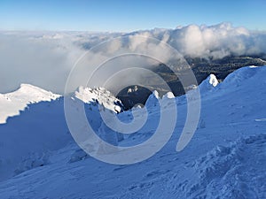 Winter in the mountains. Hiking during wintertime. Snow storm in the high mountains