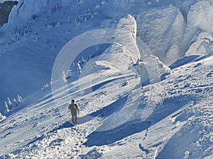 Winter in the mountains. Hiking during wintertime. Snow storm in the high mountains