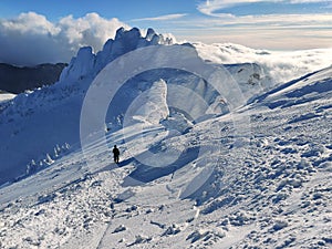 Winter in the mountains. Hiking during wintertime. Snow storm in the high mountains