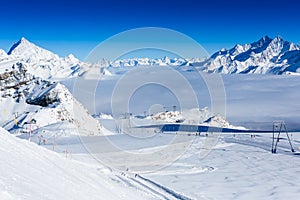 Winter mountains panorama with ski slopes and ski lifts