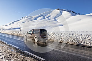 Winter moutain scenery, alpine road in Austrian, car speeding photo