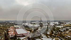 Winter in Munich, snow covered park in the heart of the bavarian metropole, a panoramic view at the olympic park with