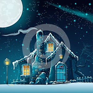 Winter night with a fabulous house and lantern photo