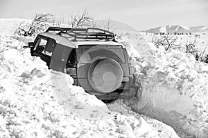 Winter offroad. Jeep in snow snowfall. Off road Adventure.