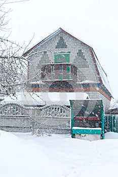 Winter. An old water well is covered in snow