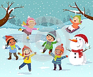 Winter outdoor activities with kids and snowman. Children playing snowballs, sledding and ice skating outdoor in winter photo