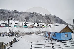 Winter over the roma houses in Viscri, Romania