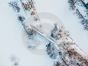 Winter panorama. Frozen trees, bushes and meadows.Winter scene - Old bridge in winter snowy park. Aerial view