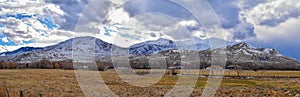 Winter Panorama of Oquirrh Mountain range snow capped, which includes The Bingham Canyon Mine or Kennecott Copper Mine, rumored th