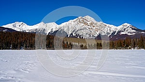 Winter panorama of the Pyramid Mountain and the frozen Patricia Lake in the Jasper National Park Alberta, Canada