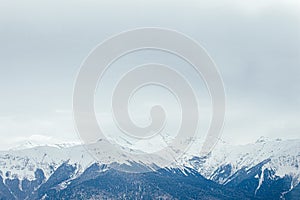 Winter panorama view of mountains. Cold winter maille cloudy day in mountains