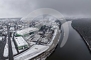 winter panoramic aerial view of the smoke of pipes of a chemical plant or woodworking enterprise. Air and water pollution concept