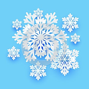 Winter paper snowflakes on blue background for Your holiday design