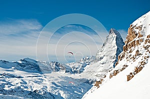 Winter paragliding over the alps