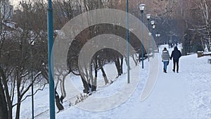 Winter park landscape. Peoples walks in winter park