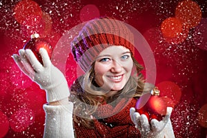 Winter, people, happiness concept - woman in scarf and gloves wi