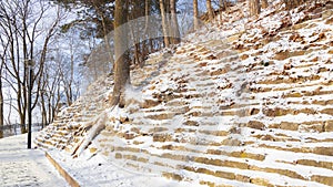 winter picturesque park land landscape designed in city with stone terraces and walking area, December morning tranquility time