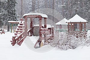 Winter playground during snowfall