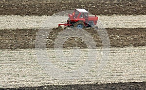 Winter plowing of the field with a tractor