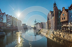 Winter and port of Old Town in Gdansk, Poland, with sailship and sunlight
