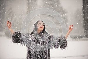 Winter portrait of Beauty girl with snow