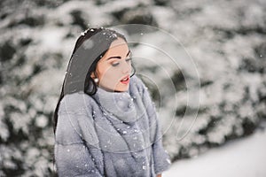 Winter portrait of Beauty girl with snow