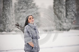 Winter portrait of Beauty girl with snow