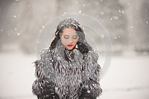 Winter portrait of Beauty girl with snow