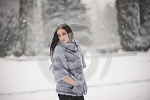 Winter portrait of Beauty girl with snow