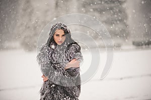 Winter portrait of Beauty girl with snow